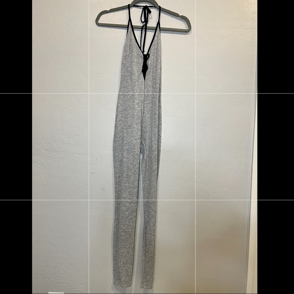 Grey jumpsuit with open back.